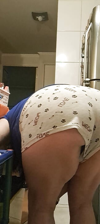 in the kitchen peeling potatoes and my husband looks at my shorts