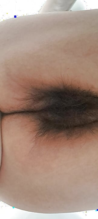 Mature milf’s fat, open, hairy pussy seen from below